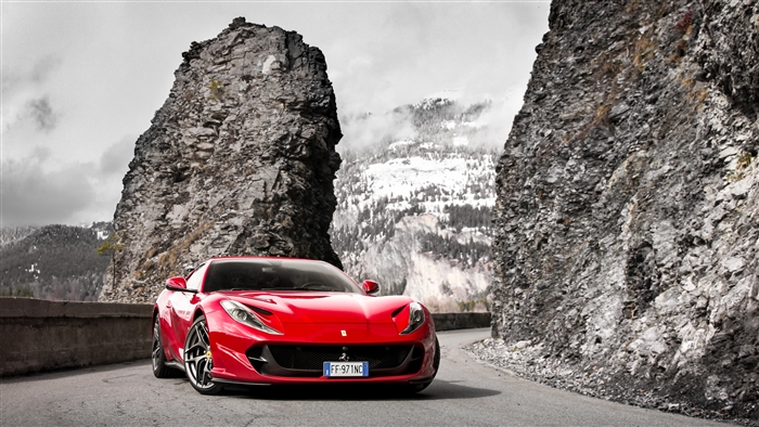 Red Ferrari Portofino on a mountain road