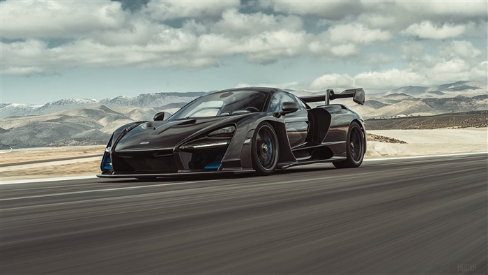 Black McLaren Senna driving on a road