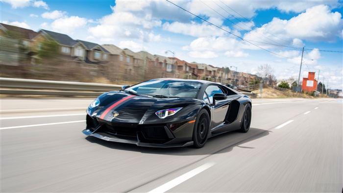 Black Lamborghini Aventador with Red Stripes on Road