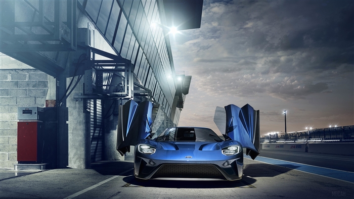 Blue Ford GT with Doors Open at Racetrack