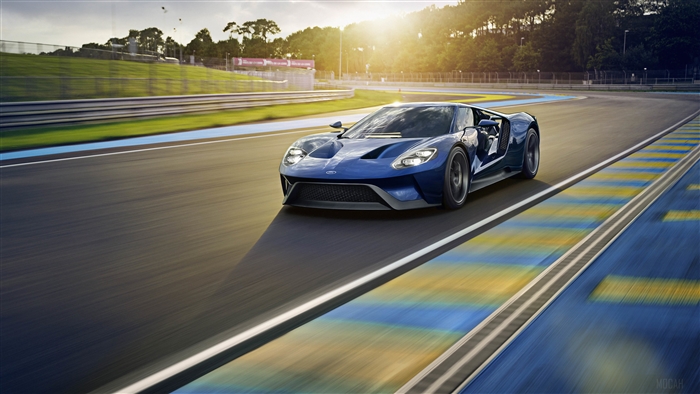Blue Ford GT driving on a race track