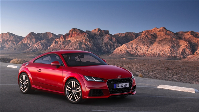 Red Audi TT Coupe 45 TFSI Quattro in desert landscape