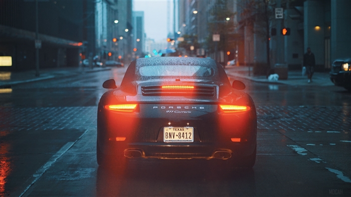 Porsche 911 Carrera in the rain on a city street