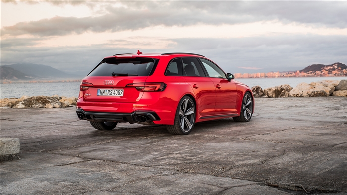 Red Audi RS 4 Avant parked by the sea