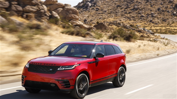 Red 2018 Range Rover Velar R Dynamic driving on a road