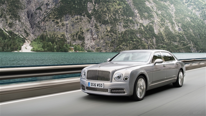 Bentley Mulsanne driving on a road by a lake