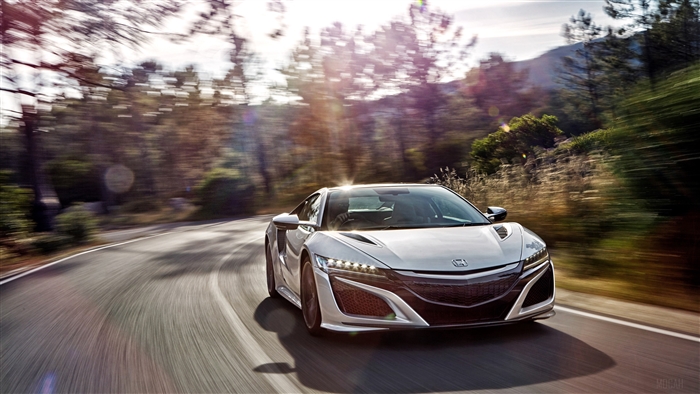 2017 Acura NSX driving on a winding road