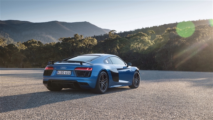 Blue Audi R8 sports car on asphalt road