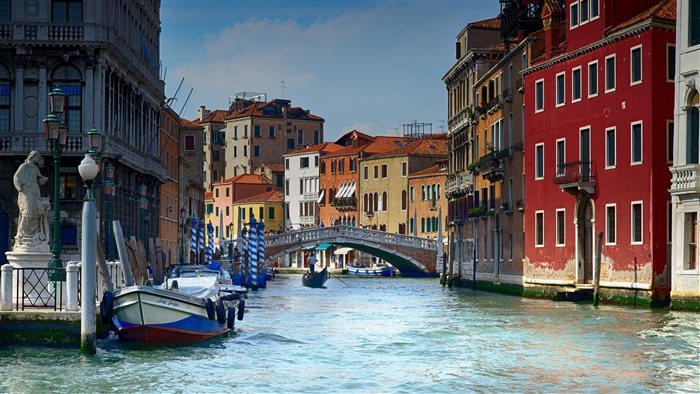 Venice canal with gondola and buildings 4K