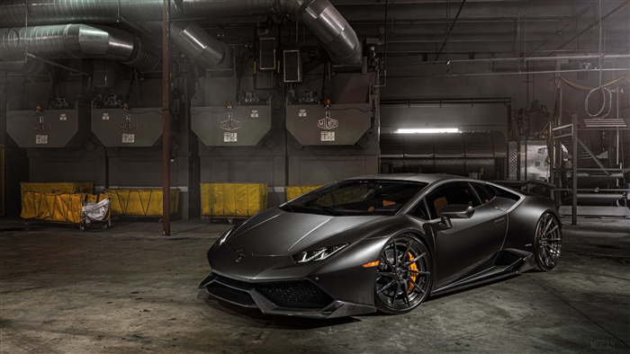 Matte black Lamborghini Huracan in a warehouse