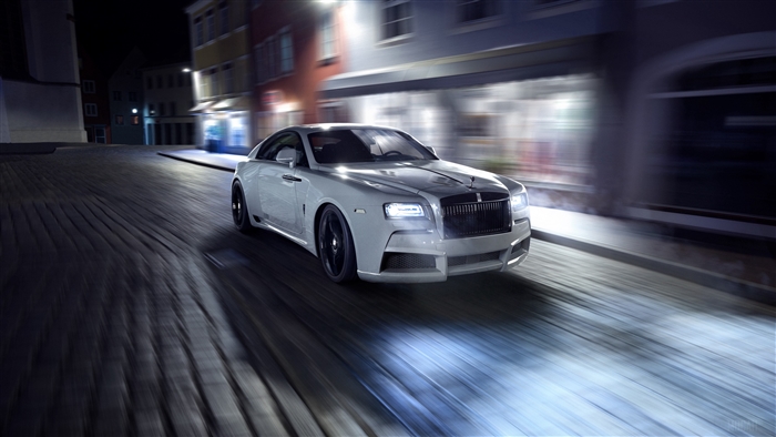 White Spofec Rolls-Royce driving at night