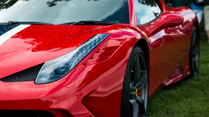 Red Ferrari 458 Speciale sports car with racing stripes