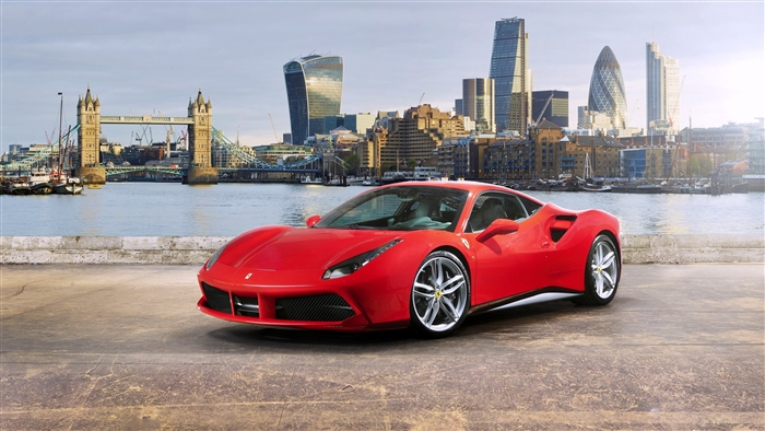 Red Ferrari 488 GTB parked by River Thames in London