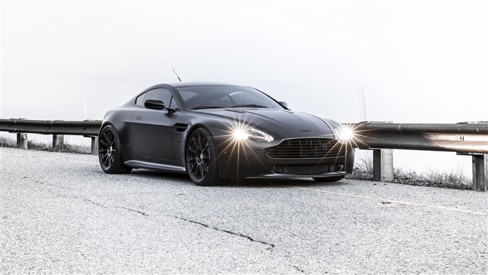 Matte black Aston Martin Vantage on a road