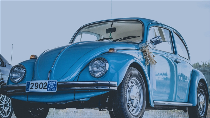 Blue retro Volkswagen Beetle car with license plate