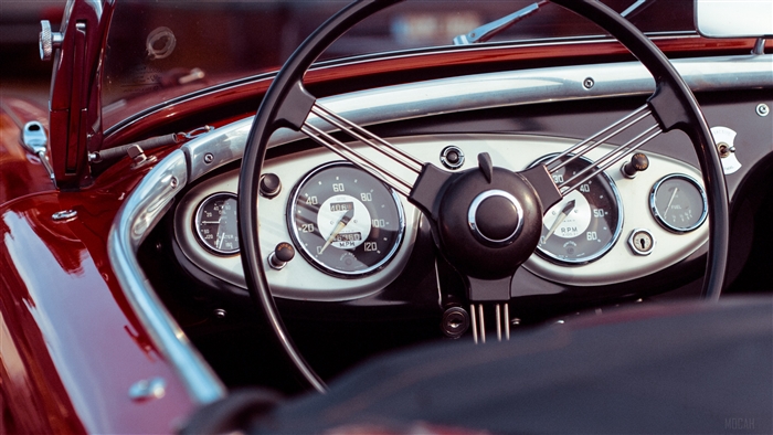 Dashboard of a vintage red convertible car