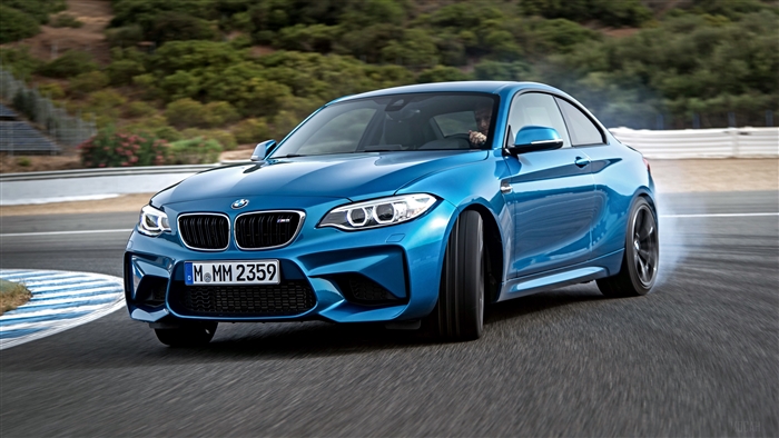 Blue BMW M2 F87 drifting on a race track 4K