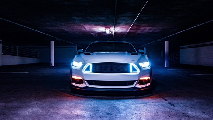 White Ford Mustang with Blue and Orange Lights