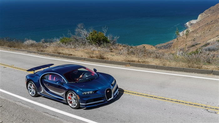 Blue Bugatti Chiron driving on coastal road 4K