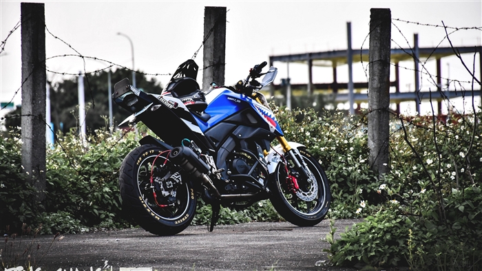 Yamaha Xabre motorcycle parked near barbed wire fence