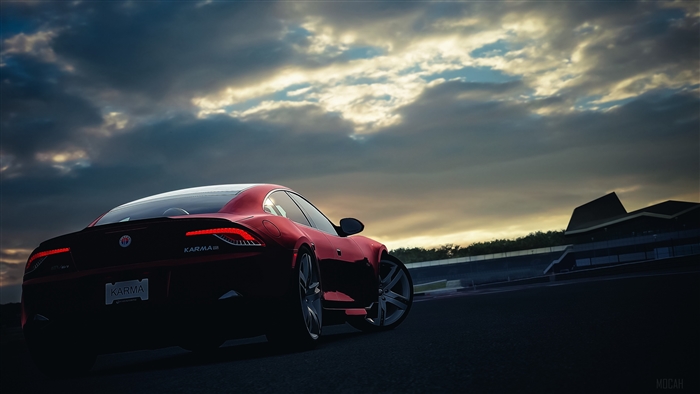 Red Karma car at sunset on a racetrack