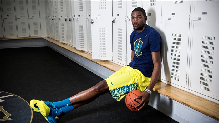 Kevin Durant in a locker room with a basketball