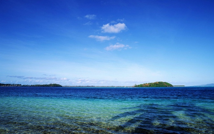 Tropical island and clear blue ocean