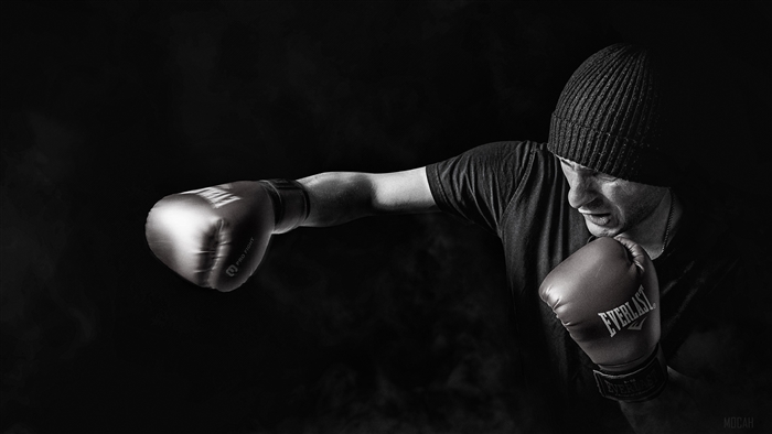 Boxer in a beanie throwing a punch