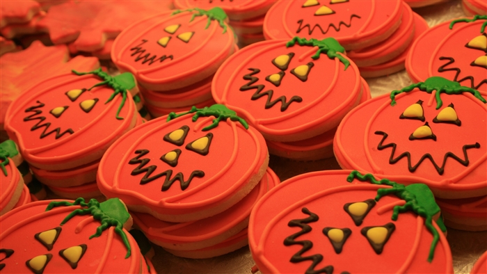 Halloween pumpkin cookies with orange frosting