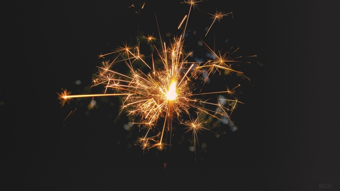Bengal fire sparks on dark background 4K