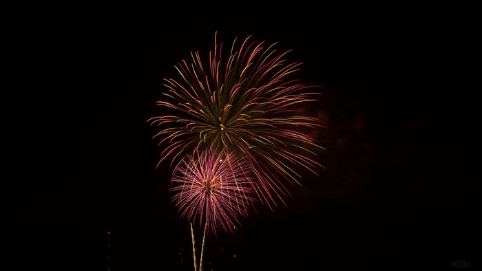 Fireworks celebration with red and yellow sparks 4K