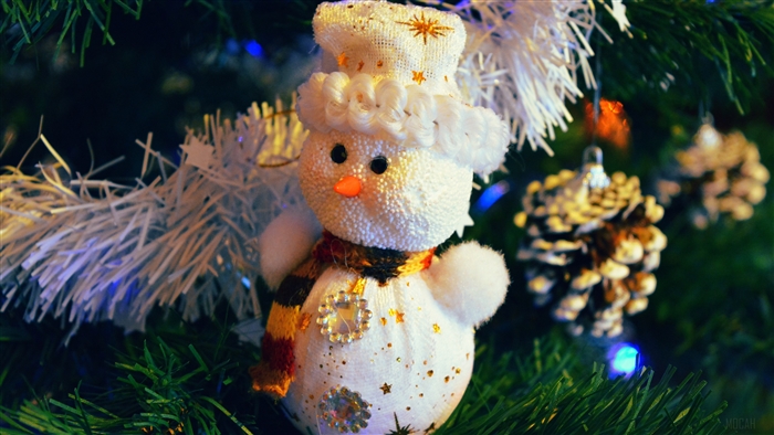 Snowman Christmas decoration on a tree
