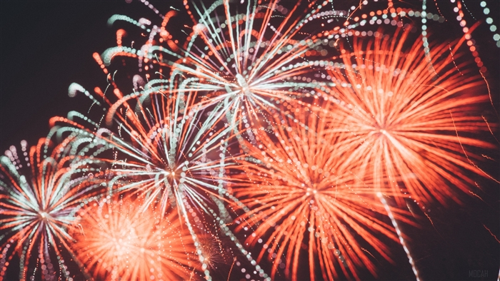Fireworks display with red and white lights