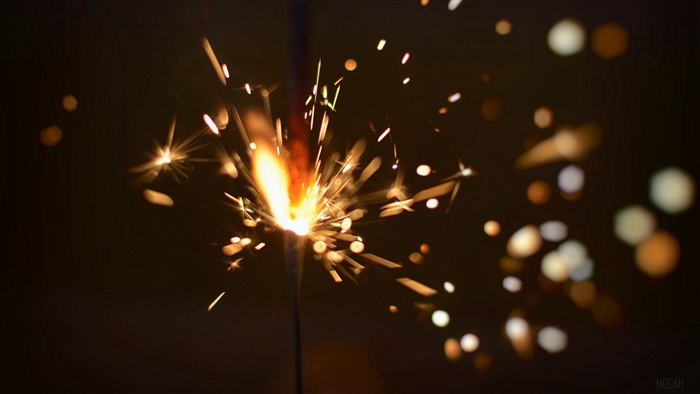 Sparkler with sparks and glare 4K