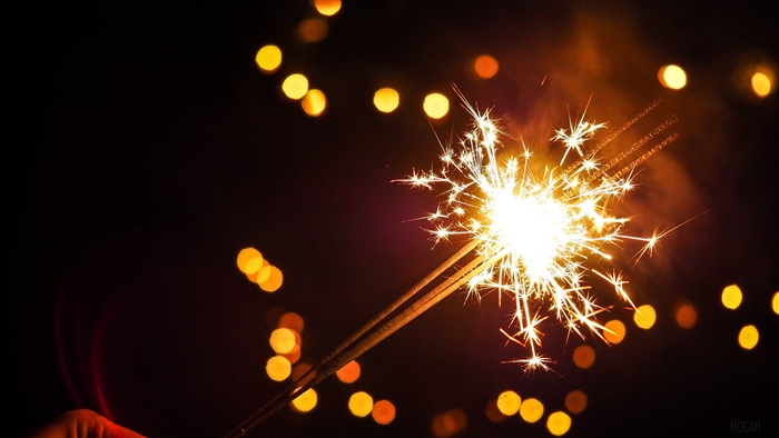 Bengal fire with sparks and bokeh lights 4K