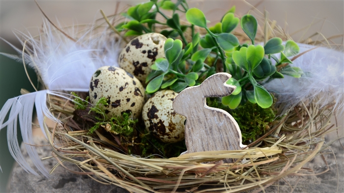 Easter nest with quail eggs and wooden rabbit 4K