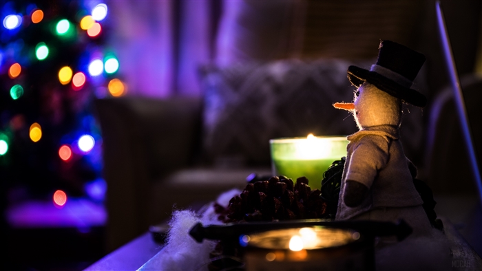 Snowman with Christmas lights and candles 4K