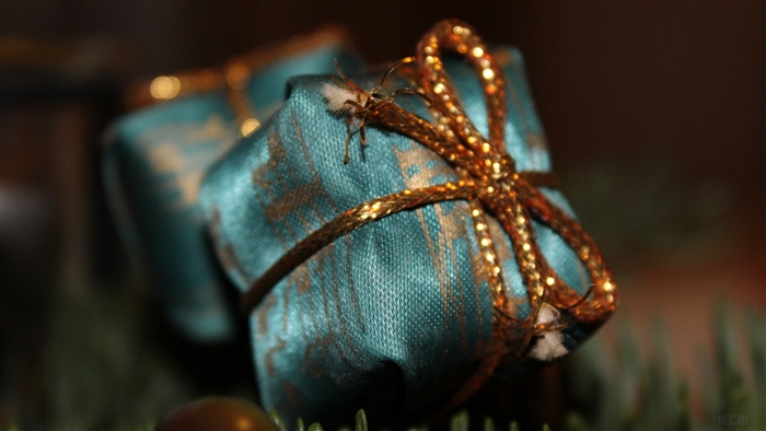 Teal Christmas gift with gold ribbon 4K
