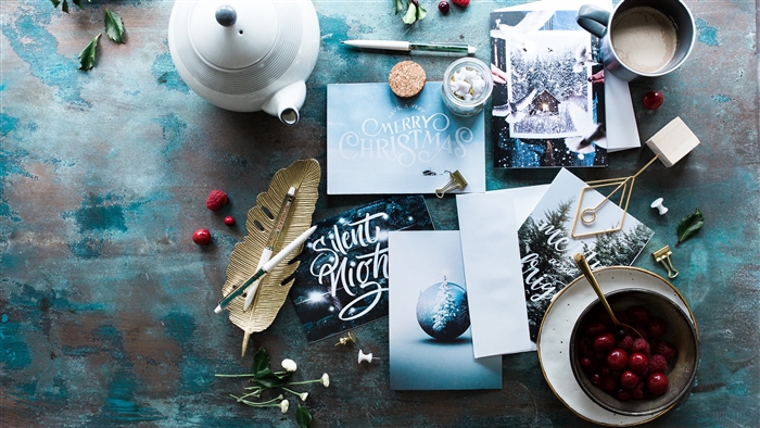 Christmas postcards and berries with tea