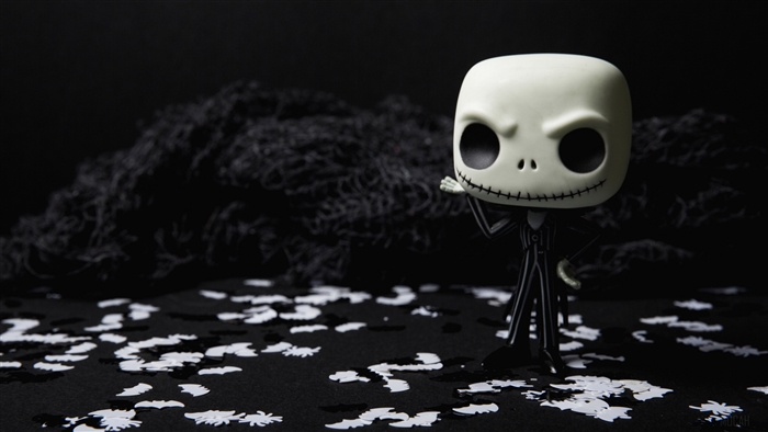 Jack Skellington Funko Pop figure on black background with confetti