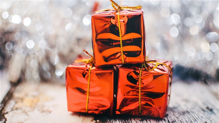 Stack of Red Christmas Gift Boxes with Bokeh