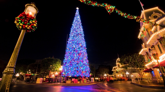 Christmas tree and decorations in a city at night