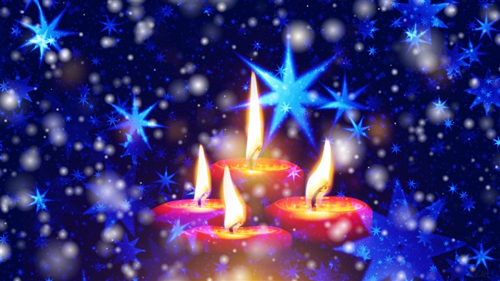 Four lit candles with blue stars and snowflakes