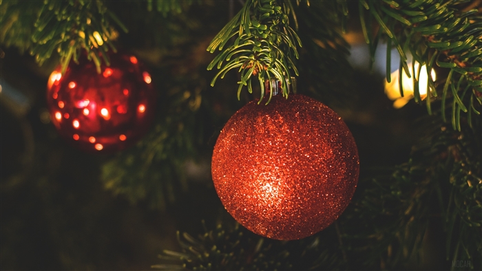 Red Christmas ornaments on a fir tree 4K