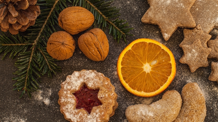 Christmas cookies with walnuts, pine cone, and orange slice 4K