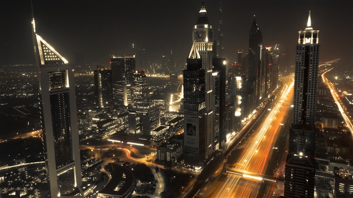 Dubai skyline at night with light trails