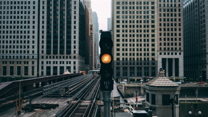 Traffic light in a city with buildings