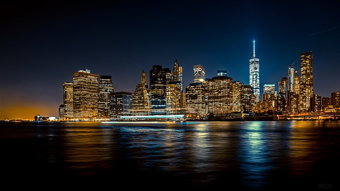 New York City skyline at night with reflections