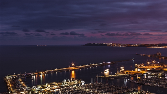 Night city port with pier and boats, top view 4K