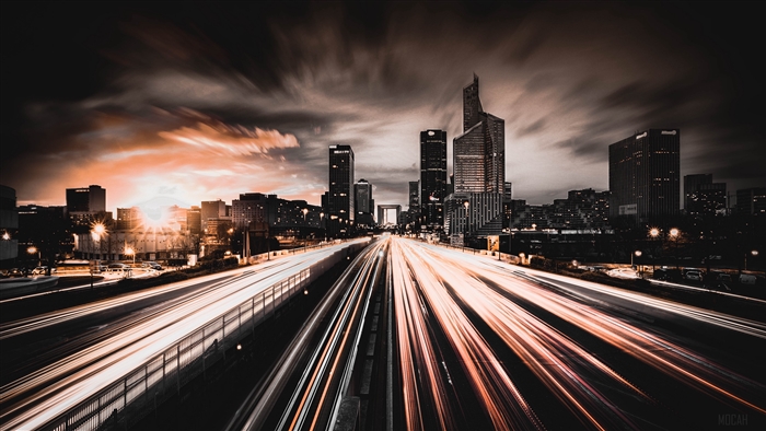 Cityscape at night with light trails and skyscrapers 4K